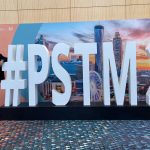 robert pearl standing in front of sign reading #pstm21