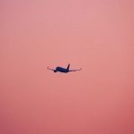 airplane against a pink sky